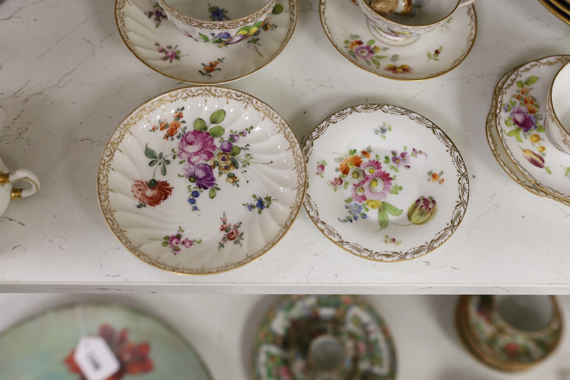 A group of Dresden floral cups and saucers, and five jewelled cabinet plates, etc.